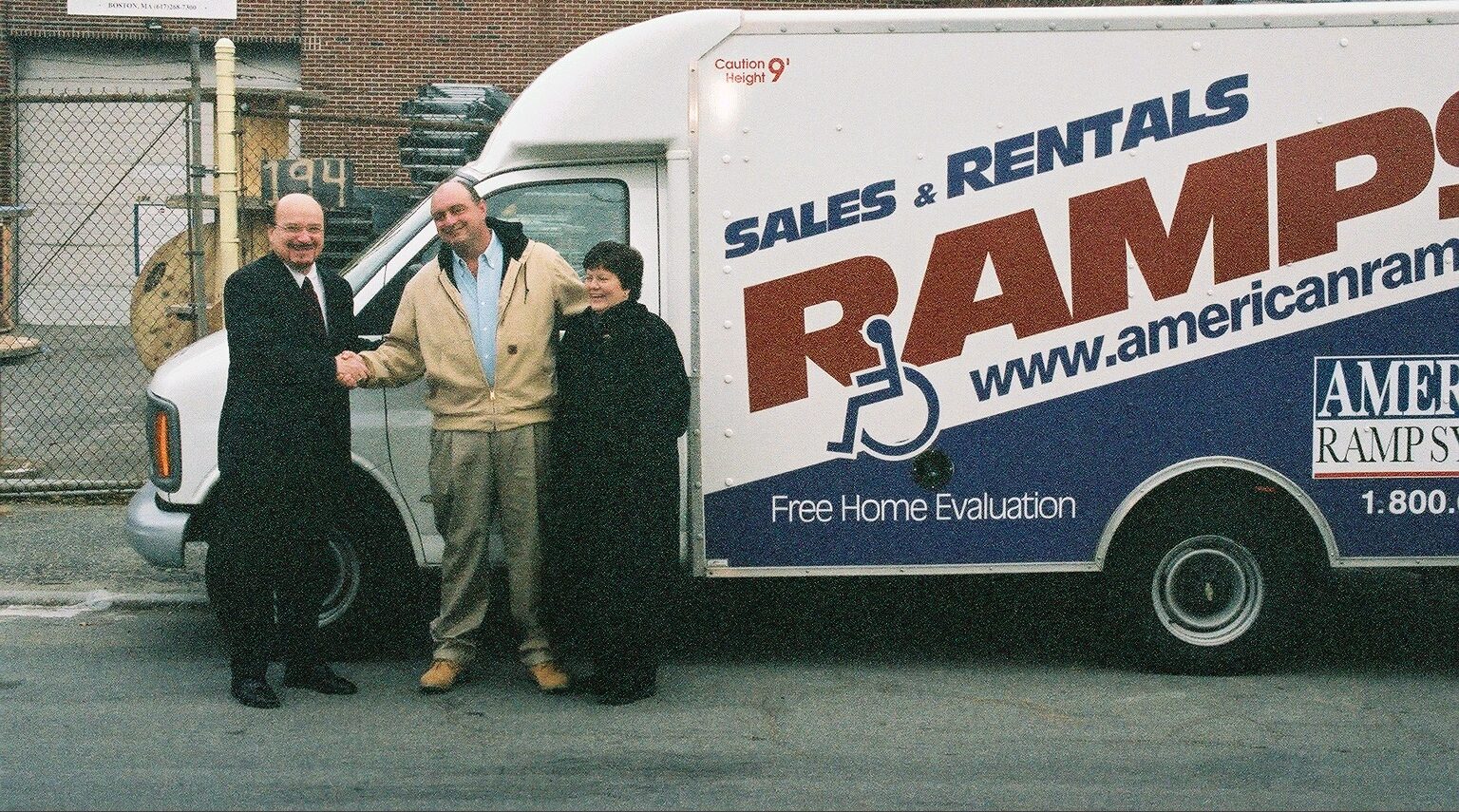 Amramp Accessibility Founder, Julian Gordon, shakes the hand of first franchisee in 2002, Keith Rielag, in Boston, MA.