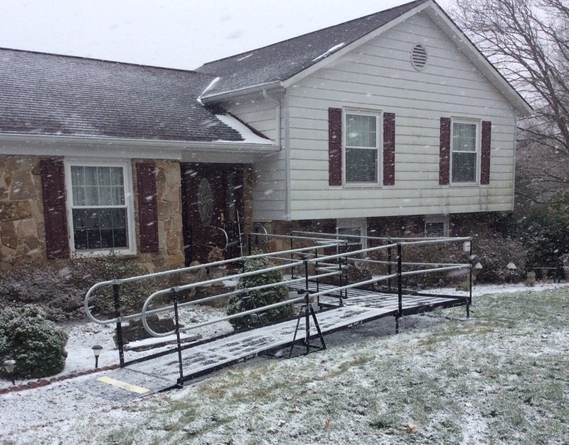 The amramp wheelchair ramp covered with snow at Randolph, MA
