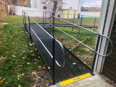 Amramp of Massachusetts traveled to a customers residence in Revere, MA in order to install this ramp over a sloped hill.