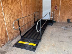 Amramp wheelchair ramp in a wooden garage