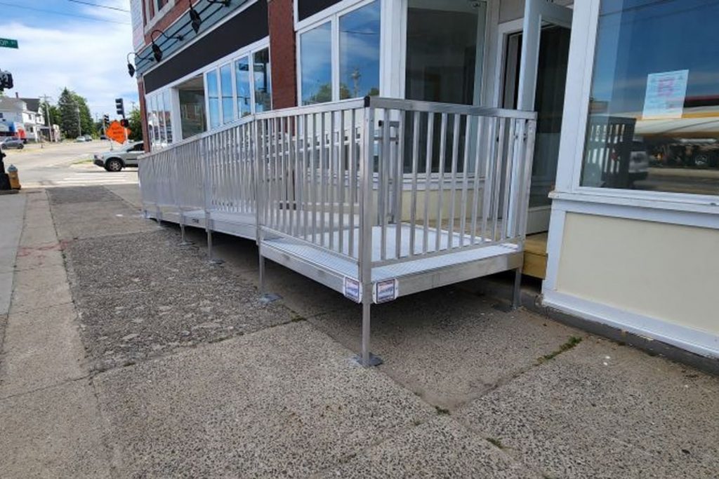 Custom wheelchair ramp showing access to storefront street level