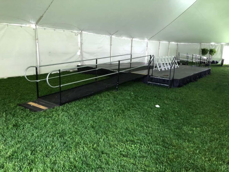 wheelchair ramp in tent outside bc campus graduation