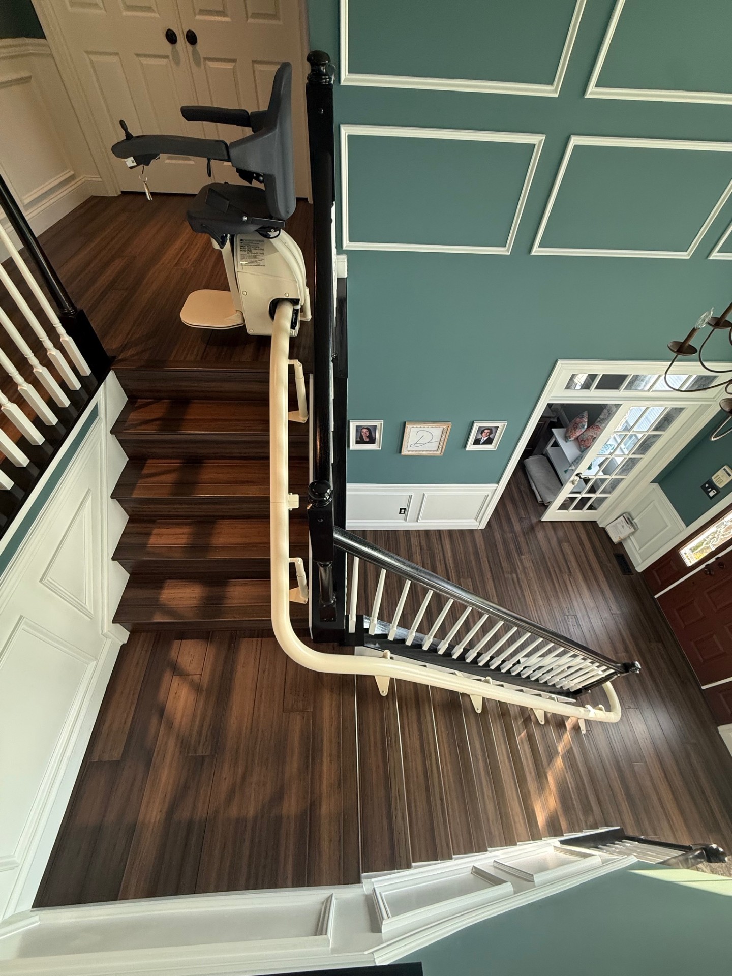 A curved stairlift with an overrun at the top and 180 degree turn at the bottom installed by Amramp Accessibility of Philadelphia.
