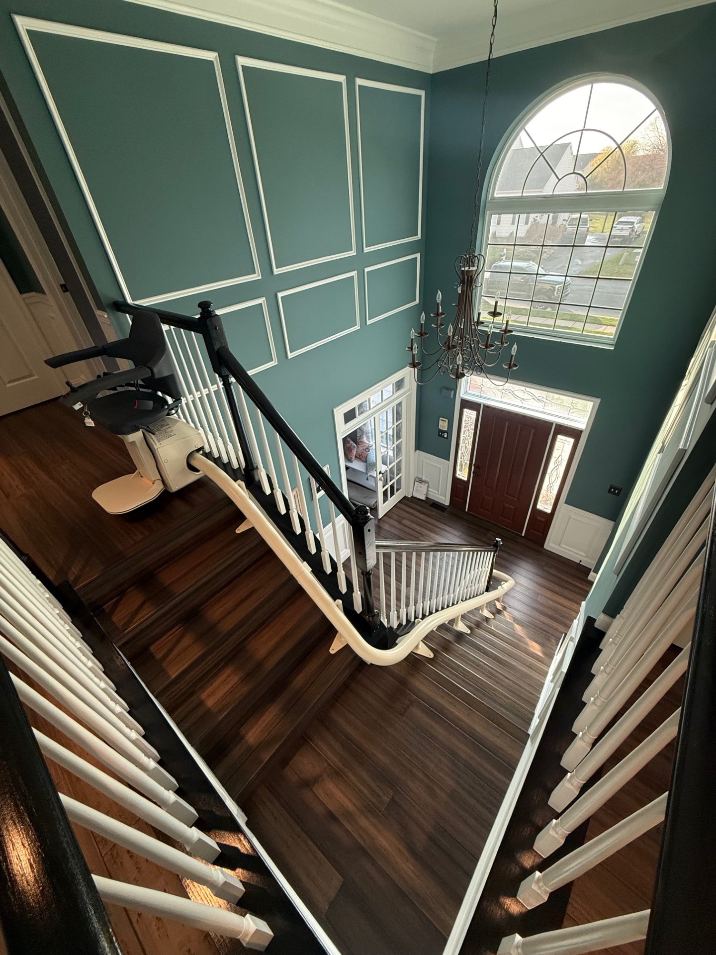 A curved stairlift with an overrun at the top and 180 degree turn at the bottom installed by Amramp Accessibility of Philadelphia.