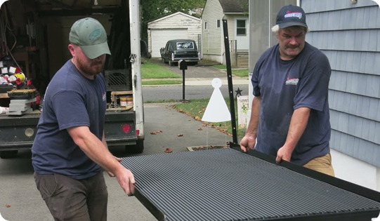 Two Amramp team members installing a new ramp