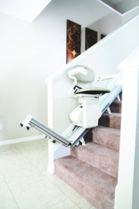 a Harmar stairlift track folding up when not in use