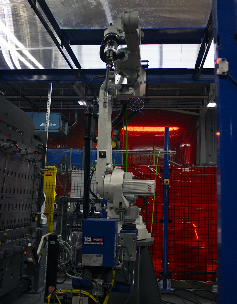 The welding robot streamlines processes in building steel modular wheelchair ramps at Amramp's headquarters in Randolph, MA