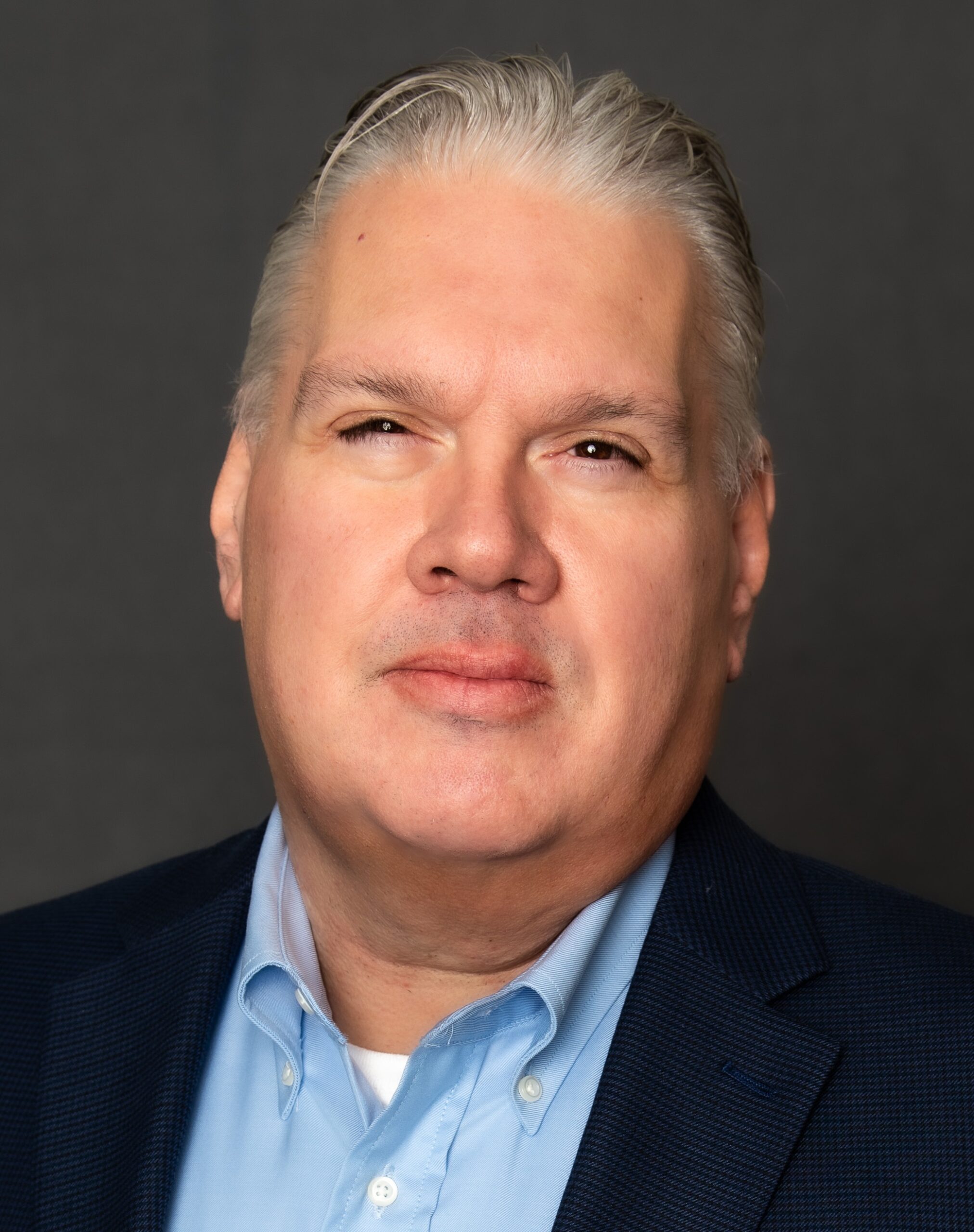 Headshot of Joel Vander Weele, the new owner of Amramp Chicago, Northern Illinois & Northeast Indiana, smiling confidently in business attire.