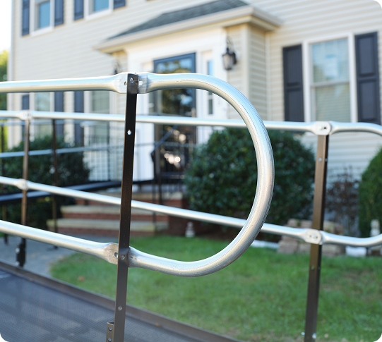 a close up view of a ramp railing in front of a home