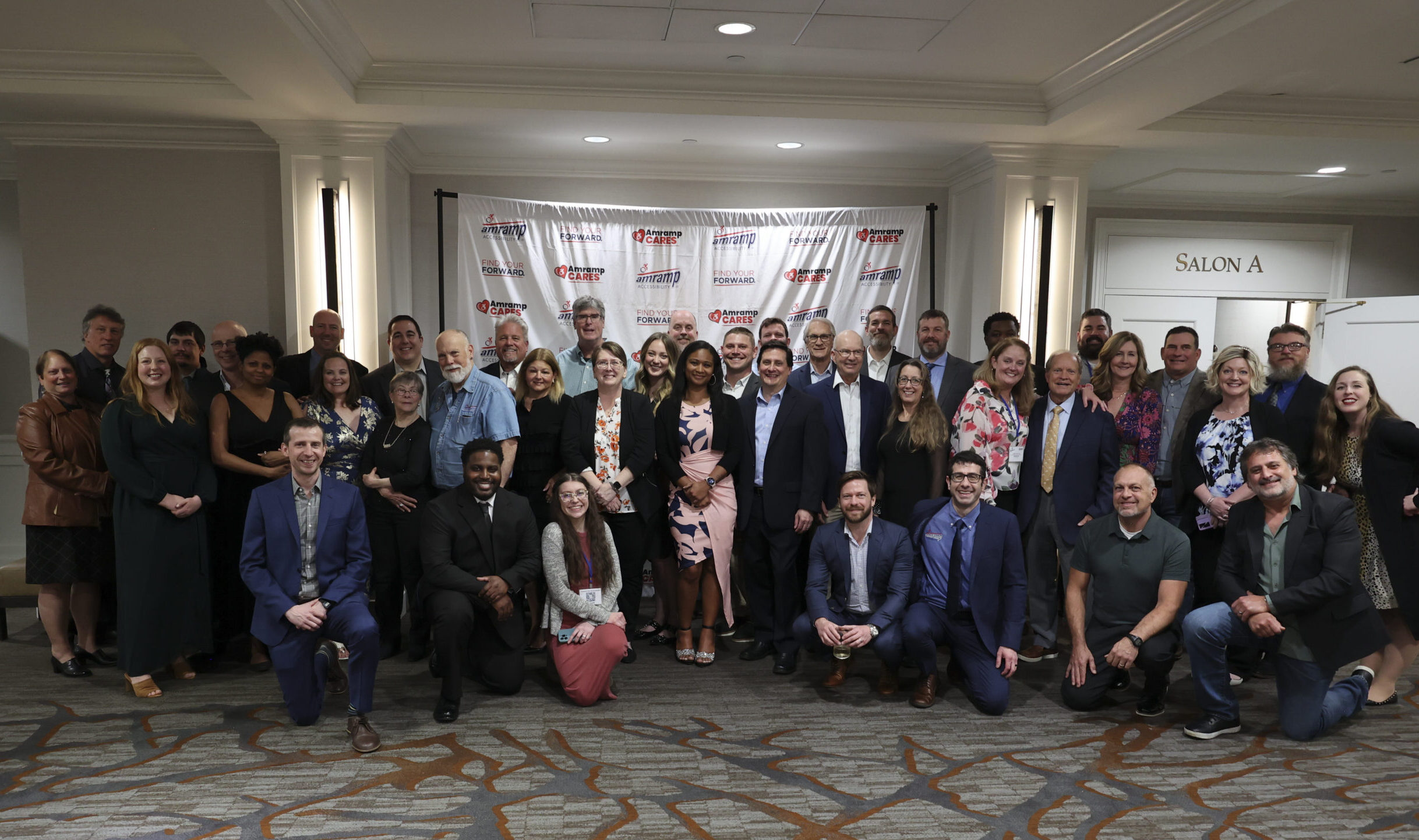 Group photo of Amramp franchise owners and headquarters team members at the company's annual partners meeting.