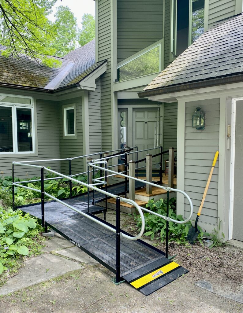 Amramp modular wheelchair ramp installed at the entrance of a residential home to provide safe, accessible access.