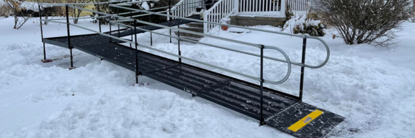 A steel metal Amramp providing accessibility in icy winter conditions