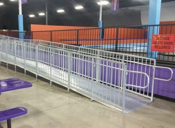 Commercial modular wheelchair ramp providing accessible access inside Altitude Trampoline Park in O’Fallon, Missouri.