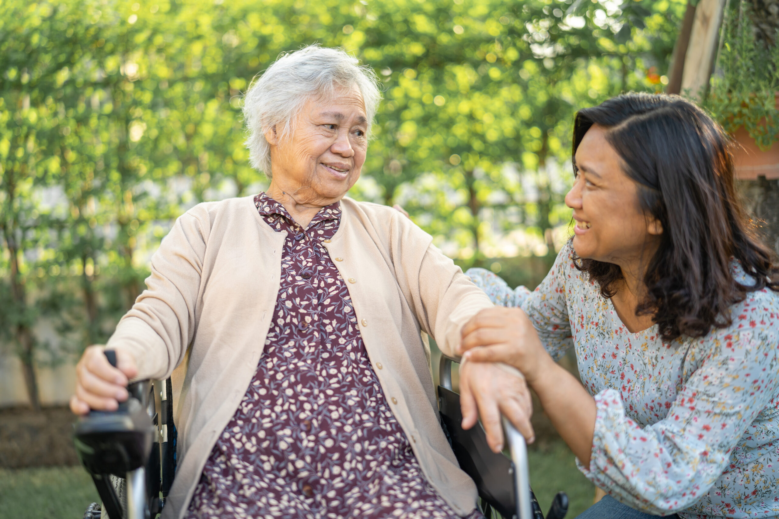 A woman and her senior mother in a wheelchair