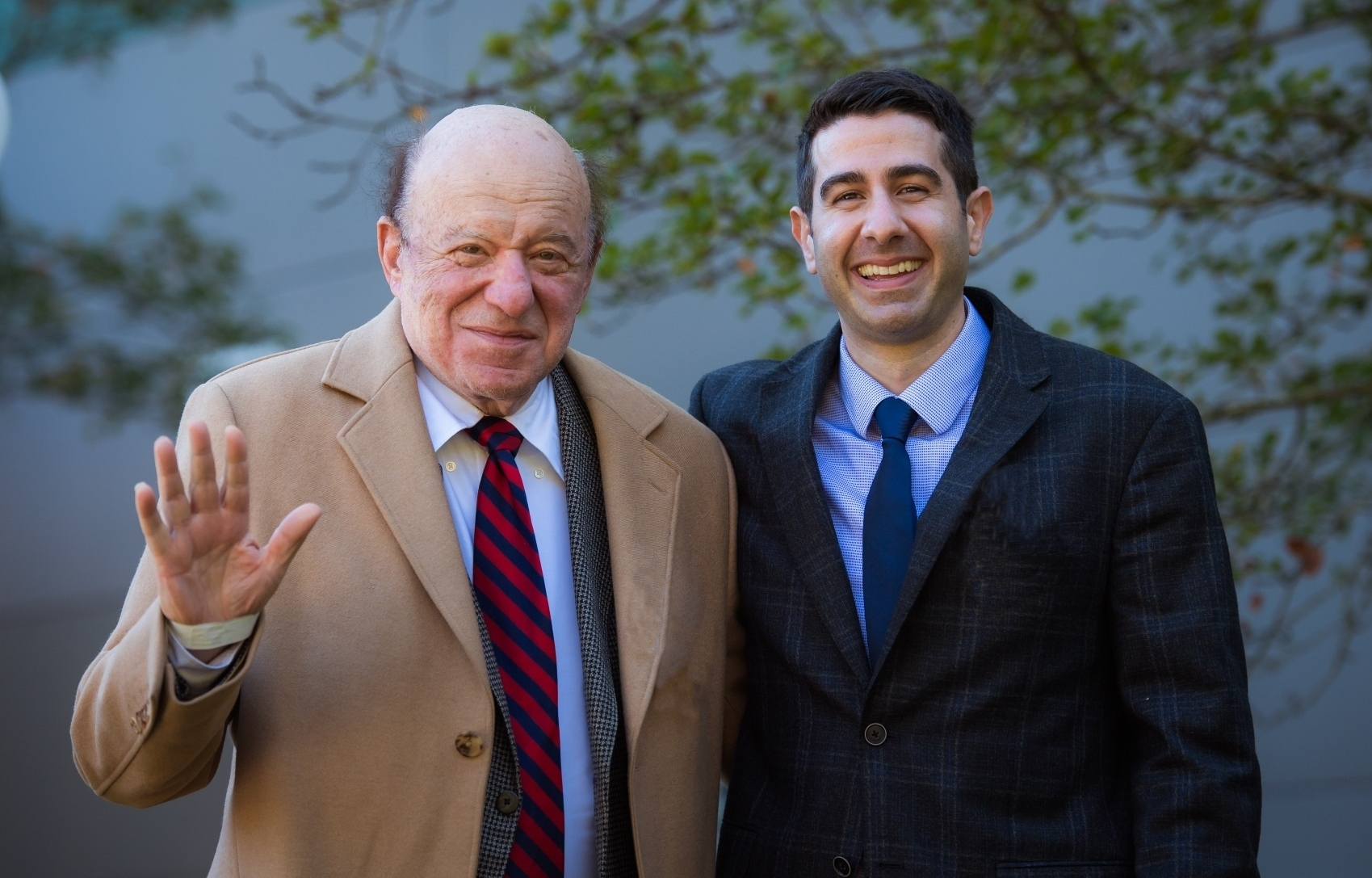 Amramp Accessibility founder, Julian Gordon, poses with son and CEO, Justin Gordon, at the opening of the new Randolph, MA production facility.
