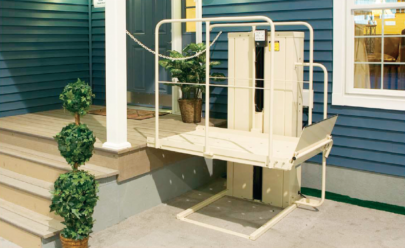 Vertical platform lift (VPL) with a sturdy lift gate installed on a MAC’s lift system, designed for safe and accessible wheelchair entry.